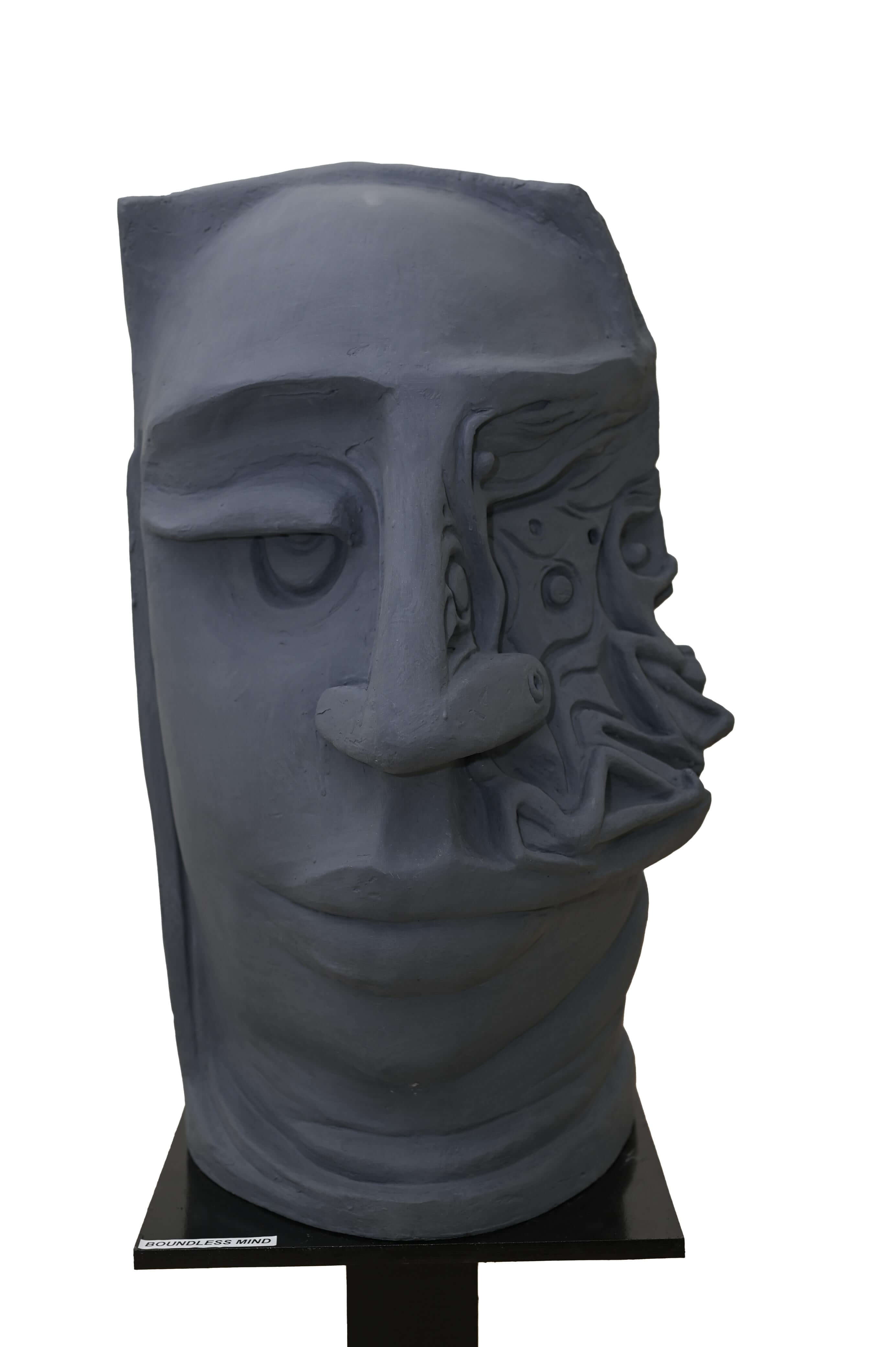 Abstract grey face sculpture with surreal carved patterns, modern contemporary art for home and gallery décor