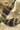 Close up of natural amethyst and peridot gemstones on handcrafted silver necklace